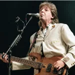 Paul McCartney performs at the Fourth of July concert in the Robert F. Kennedy football stadium. Washington DC. USA^ 4th July^ 1990