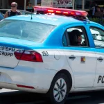 RIo de Janeiro^ RJ^ Brazil - March 20^ 2016: Rio de Janeiro Military Police car patrolling Copacabana waterfront