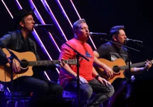 Joe Don Rooney^ Gary LeVox and Jay DeMarcus (L-R) of Rascal Flatts perform at CBS Radio's Stars & Stripes event at the Chicago Theatre on November 9^ 2016 in Chicago^ Illinois.