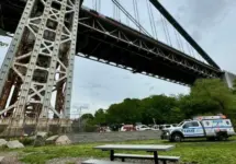 NYPD Police truck responding to a person who has climbed up the George Washington Bridge in Fort Washington Park New York^ NY USA - May 18^ 2024