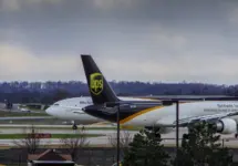 Louisville^ KY—March 6^ 2018 air cargo planes taxi to end of runway prior to take off