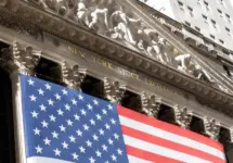 Grand American flag displayed on the facade of the New York Stock Exchange in downtown Manhattan. New York^ NY^ USA - 11.05.2024