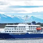 MV Hondius^ a purpose-built^ environmentally-friendly expedition cruise ship^ departs from the port of Ushuaia. Ushuaia^ Argentina - January 4 2025