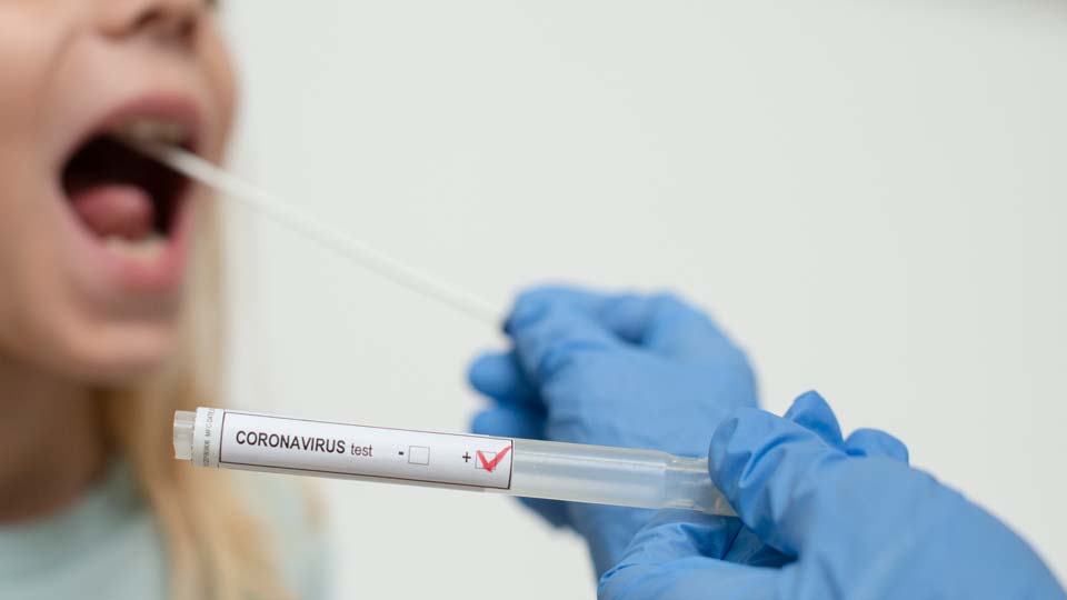 xcovid-mouth-swab-testing