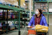 woman-with-protection-face-mask-shopping-cart-supermarket_177613-903-min-2