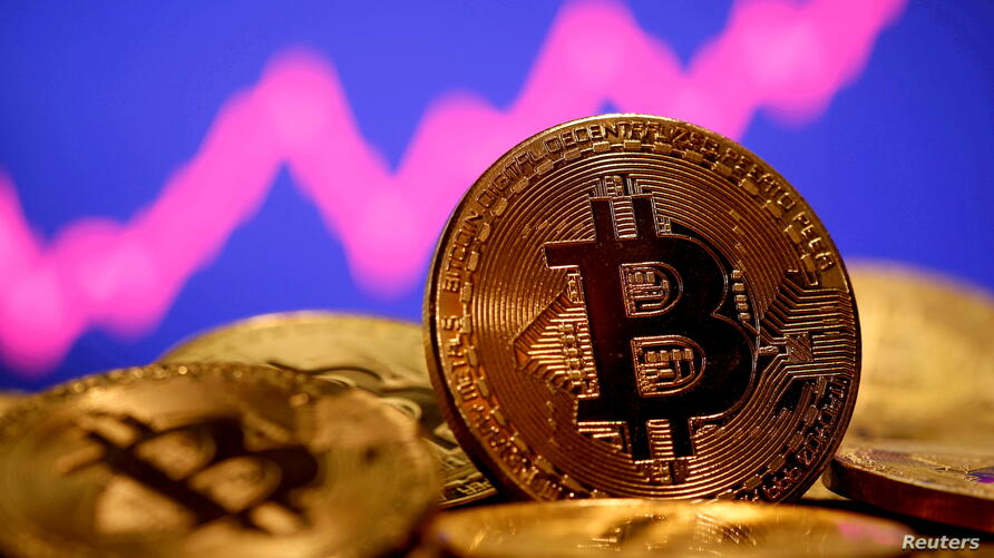 file-photo-a-representation-of-virtual-currency-bitcoin-is-seen-in-front-of-a-stock-graph-in-this-illustration-taken