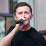 Country music artist Scotty McCreery performs onstage at Fox and Friends' All-American Summer Concert Series at 48th Street and 6th Avenue on July 31^ 2015 in New York City.