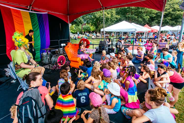 Seattle-based drag queen Aleska Manila reading to children at PrideFest Cap Hill in Cal Anderson park
