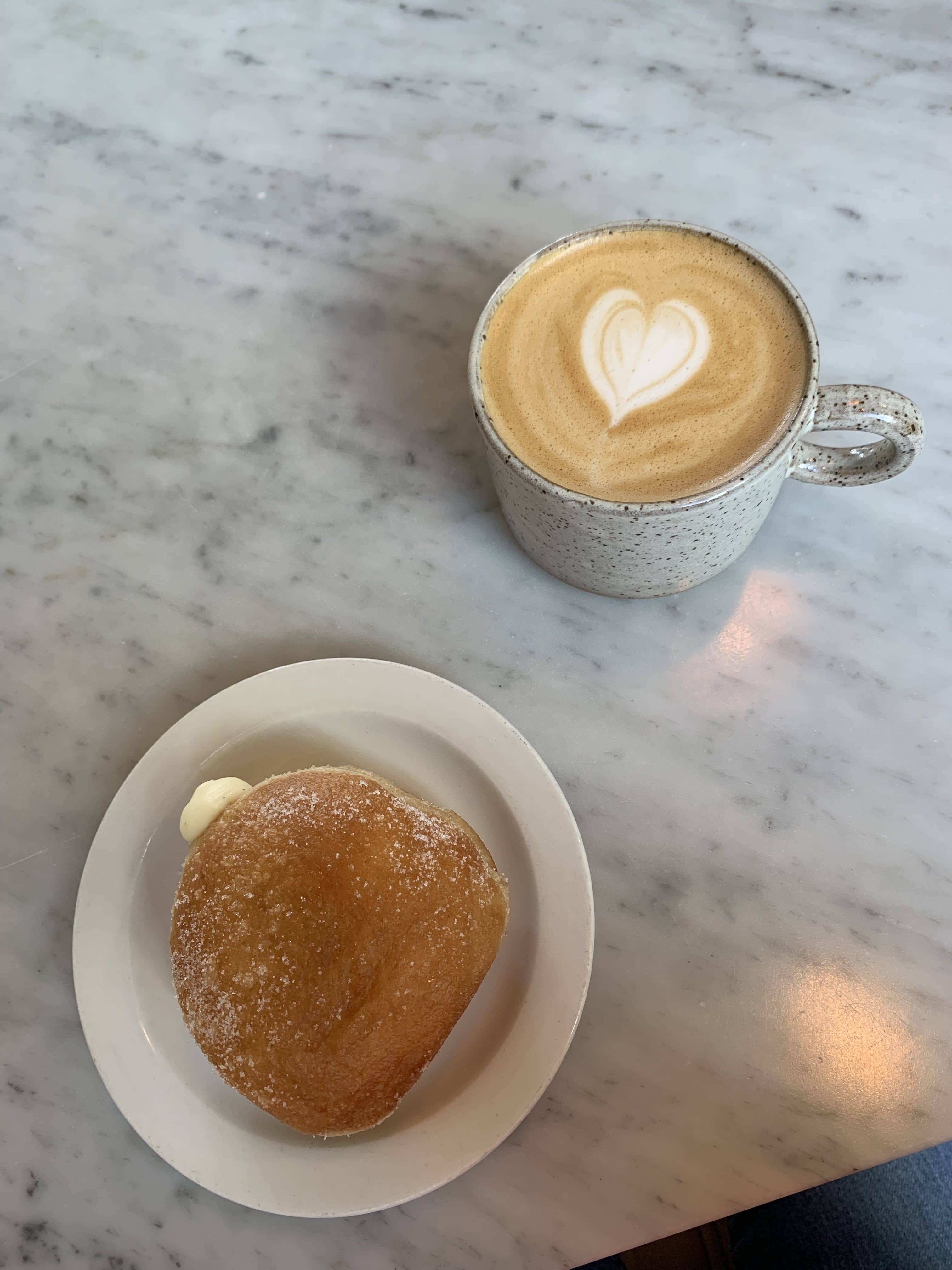 doughnut next to a latte