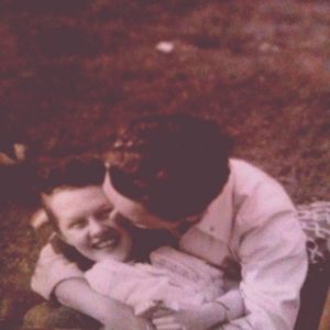 sepia photo of a man and woman kissing; vintage feeling