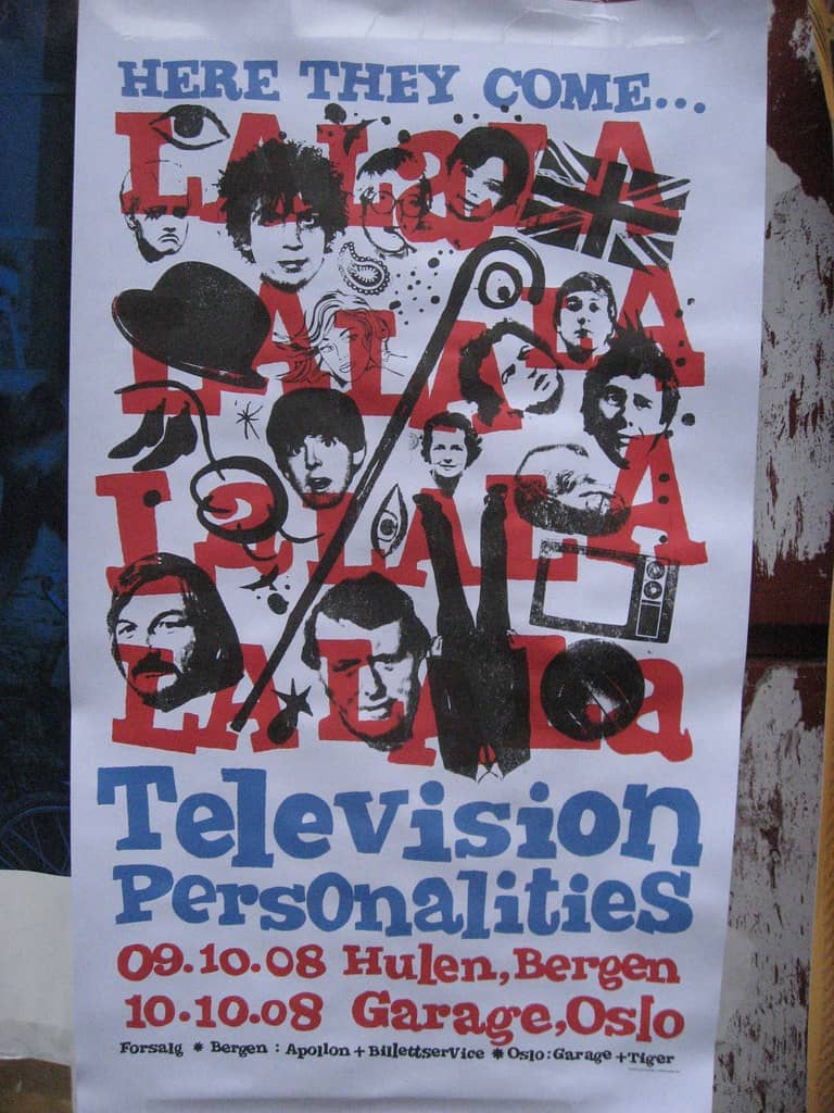This photograph shows a 2008 Television Personalities Show Poster in Norway. The background of the poster reads: “Here They Come . . . La La La La La La, La La La La La La. Television Personalities. 09.10.08 Hulen, Bergen. 10.10.08 Garage, Oslo.” Spread out between the text are images of various famous people, including John Lennon, Paul McCartney, Siouxsie Sioux, Syd Barrett, and more.