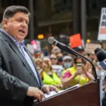 Protests in downtown Chicago after overturning of Roe v. Wade^ Governor of Illinois^ J. B. Pritzker^ talking to protester in support Chicago^ Illinois - June 24 2022