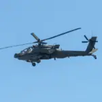 Army Apache AH-64 Helicopter during the Dragoon Ride Exercise on March 22^ 2015 in Vilnius^ Lithuania. The Boeing AH-64 Apache is a four-blade^ twin-turboshaft attack helicopter. VILNIUS - MAR 22