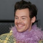 getty_harrystylessmiling_091321