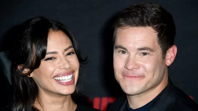 getty_adam_devine_and_wife_10032023266557
