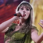 getty_taylorswiftgreenarm_080224818823