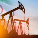 Oil drilling derricks at desert oilfield with Iran flag. The change in oil prices caused by the war. Oil prices are rising because of the global crisis. Crude oil production from the ground.
