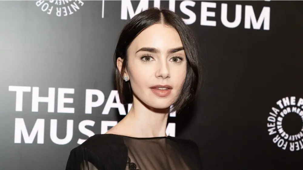 Lily Collins wearing dress and shoes by Versace attends PaleyLive program: Emily in Paris: The Magic Behind the Scenes at Paley Center for MEdia in New York on September 17^ 2024