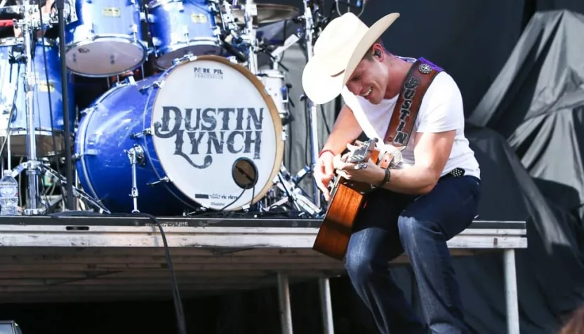 Dustin Lynch performs during the 'Kick The Dust Up' Tour at Vanderbilt Stadium on July 11^ 2015 in Nashville^ Tennessee.