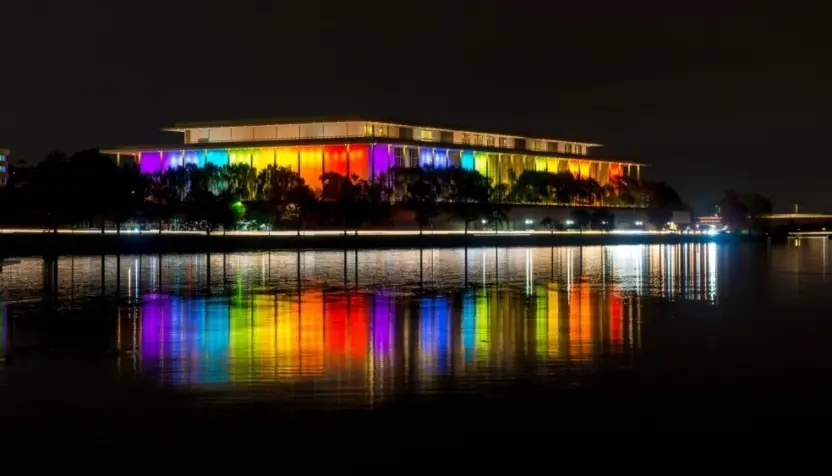The Kennedy Center illuminated in a rainbow of colors in recognition of the upcoming Kennedy Center Honors. Washington^ DC / USA - November 19^ 2019