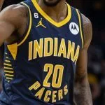 professional male nba basketball indiana pacers player^ screaming^ pointing finger up