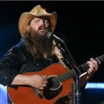 Chris Stapleton performs at the 2018 CMA Fest at Nissan Stadium on June 9^ 2018 in Nashville^ Tennessee.