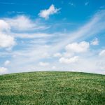 green-grass-field-under-white-clouds-1048039
