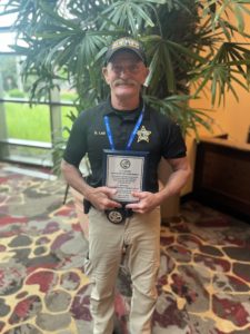 Dale Lail holding award