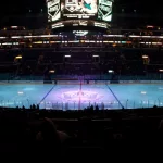 pro ice hokey rink lit up at nighttime