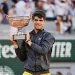 Roland Garros champion Carlos Alcaraz of Spain during trophy presentation after men's final match victory against Alexander Zverev of Germany in Paris^ France. PARIS^ FRANCE - JUNE 9^ 2024