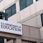The exterior sign and US flag in front of the U.S. Department of Education offices in Washington^ DC. Washington^ DC USA; September 5^ 2024