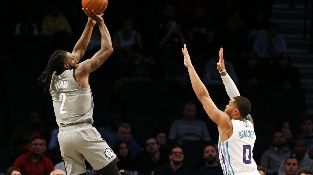 Nov 20, 2019; Brooklyn, NY, USA; Brooklyn Nets forward Taurean Prince (2) shoots while being defended by Charlotte Hornets forward Miles Bridges (0) during the first half at Barclays Center. Mandatory Credit: Andy Marlin-USA TODAY Sports