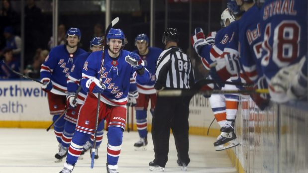 Jan 13, 2020; New York, New York, USA; New York Rangers left wing Artemi Panarin (10) celebrates with teammates after scoring a goal during the third period against the New York Islanders at Madison Square Garden. Mandatory Credit: Adam Hunger-USA TODAY Sports