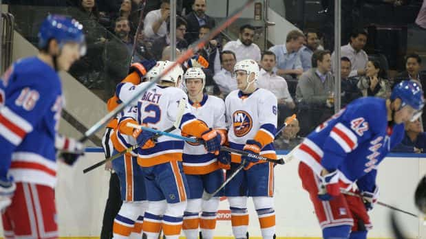 Jan 21, 2020; New York, New York, USA; New York Islanders left wing Anthony Beauvillier (18) celebrates with teammates after scoring a power play goal against the New York Rangers during the first period at Madison Square Garden. Mandatory Credit: Brad Penner-USA TODAY Sports