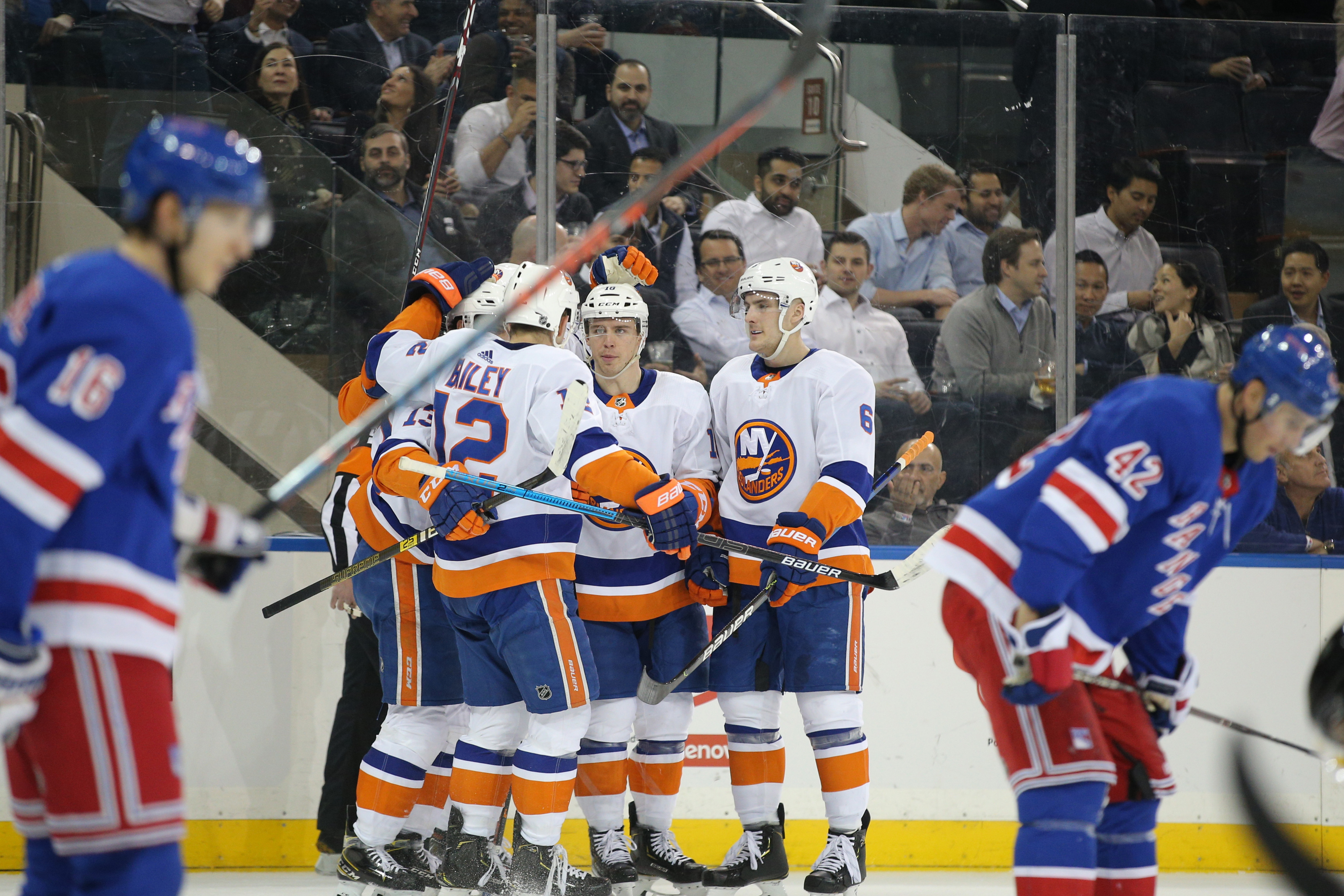 Jan 21, 2020; New York, New York, USA; New York Islanders left wing Anthony Beauvillier (18) celebrates with teammates after scoring a power play goal against the New York Rangers during the first period at Madison Square Garden. Mandatory Credit: Brad Penner-USA TODAY Sports