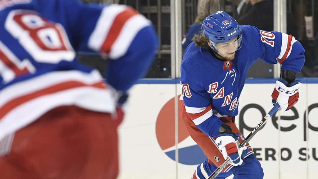 Feb 5, 2020; New York, New York, USA; New York Rangers left wing Artemi Panarin (10) takes a shot as Toronto Maple Leafs defenseman Jake Muzzin (8) defends during the second period at Madison Square Garden. Mandatory Credit: Sarah Stier-USA TODAY Sports