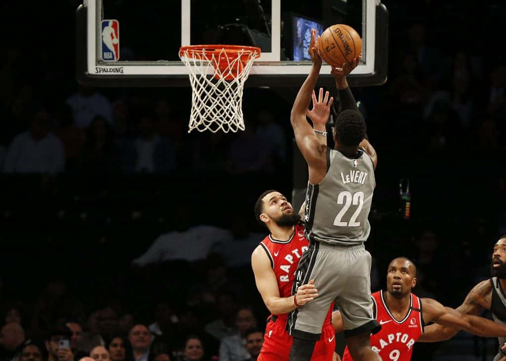 Feb 12, 2020; Brooklyn, New York, USA; Brooklyn Nets guard Caris LeVert (22) shoots over Toronto Raptors guard Fred VanVleet (23) during the first half at Barclays Center. Mandatory Credit: Andy Marlin-USA TODAY Sports