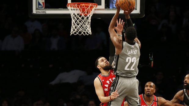 Feb 12, 2020; Brooklyn, New York, USA; Brooklyn Nets guard Caris LeVert (22) shoots over Toronto Raptors guard Fred VanVleet (23) during the first half at Barclays Center. Mandatory Credit: Andy Marlin-USA TODAY Sports