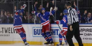 Mar 5, 2020; New York, New York, USA; New York Rangers center Mika Zibanejad (93) celebrates his fourth goal of the game against the Washington Capitals with teammates during the third period at Madison Square Garden. Mandatory Credit: Brad Penner-USA TODAY Sports