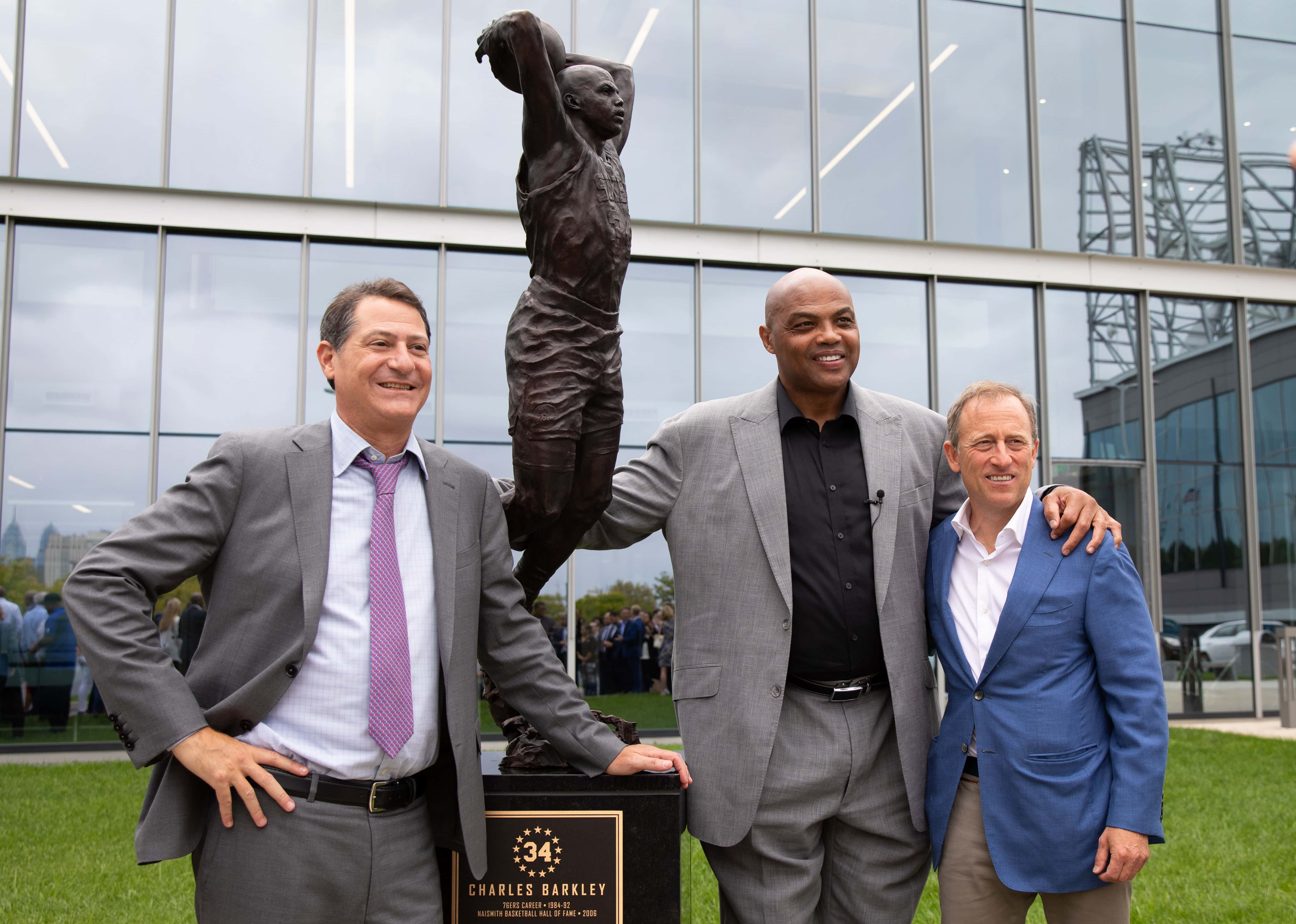 Sep 13, 2019; Philadelphia, PA, USA; Philadelphia 76ers great Charles Barkley (M) poses for a photo with managing partners David Blitzer (L) and Josh Harris (R) after the unveiling of a statue honoring him in a ceremony at the Philadelphia 76ers Training Complex. Mandatory Credit: Bill Streicher-USA TODAY Sports