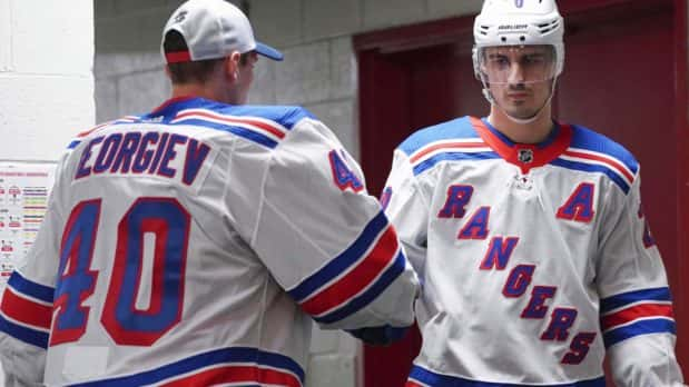 Feb 21, 2020; Raleigh, North Carolina, USA; New York Rangers left wing Chris Kreider (20) comes out of the locker room past goaltender Alexandar Georgiev (40) against the Carolina Hurricanes at PNC Arena. The New York Rangers defeated the Carolina Hurricanes 5-2. Mandatory Credit: James Guillory-USA TODAY Sports