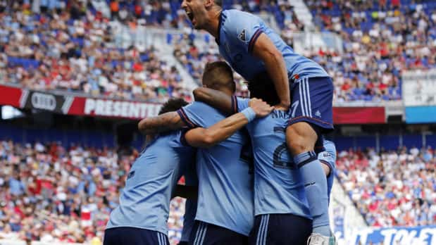 Jun 24, 2017; Harrison, NJ, USA; New York City FC defender RJ Allen (27) celebrates a goal scored by NYCFC defender Ben Sweat against the New York Red Bulls during the second half at Red Bull Arena. Mandatory Credit: Adam Hunger-USA TODAY Sports