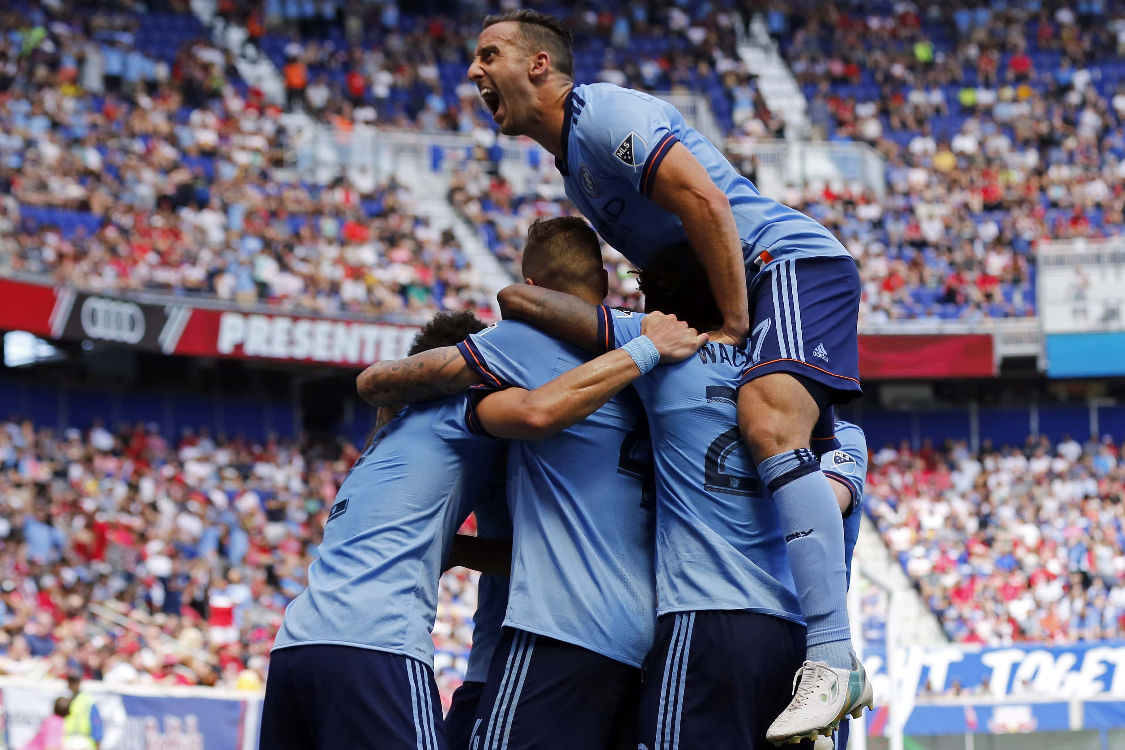 Jun 24, 2017; Harrison, NJ, USA; New York City FC defender RJ Allen (27) celebrates a goal scored by NYCFC defender Ben Sweat against the New York Red Bulls during the second half at Red Bull Arena. Mandatory Credit: Adam Hunger-USA TODAY Sports