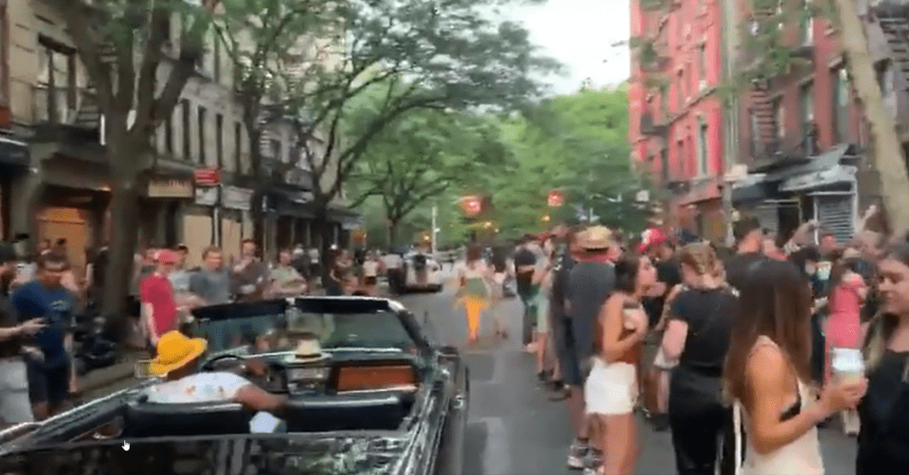 WATCH– Large Crowd Gathers in East Village Without COVID Precautions