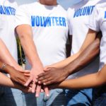 multi-ethnic-volunteer-group-hands-together