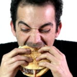 a-caucasian-adult-man-eating-burger-greedy-hd1080p-slow-motion