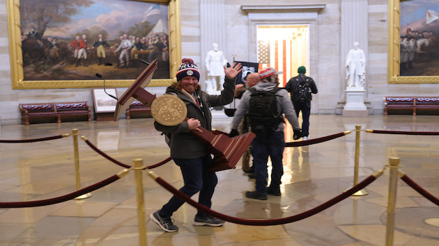 Capitol rioter seen carrying off Nancy Pelosi's lectern in viral image