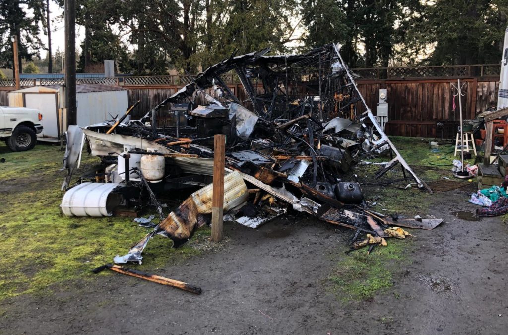 Victim of trailer fire sustains burns, home a total