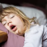 funny-face-of-child-sleeping-on-king-bed-4