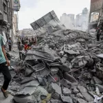 People search the Khan Yunis municipality building after an Israeli air strike^ in the city of Khan Yunis^ southern of the Gaza Strip^ October 10^ 2023.
